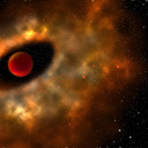Artists rendering of a young star in space, with a cloudy ring of material surrounding it.