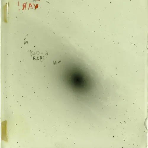 Emulsion side of photographic plate H335H, created by Edwin Hubble with the Hooker 100-inch telescope of the Mount Wilson Observatory.