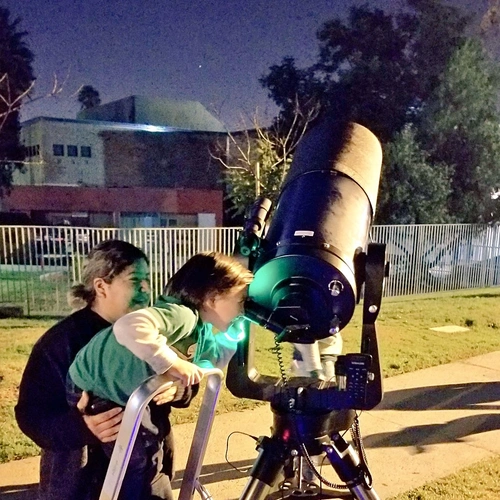  Neighborhood Astronomy Night participants get excited about stargazing. Image courtesy of Carnegie Institution for Science.