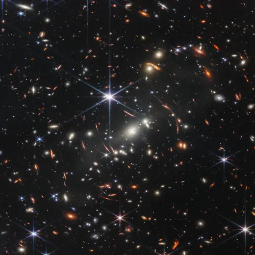Thousands of galaxies flood this near-infrared image of galaxy cluster SMACS 0723. High-resolution imaging from NASA’s James Webb Space Telescope combined with a natural effect known as gravitational lensing made this finely detailed image possible. Credit: NASA, ESA, CSA, STScI